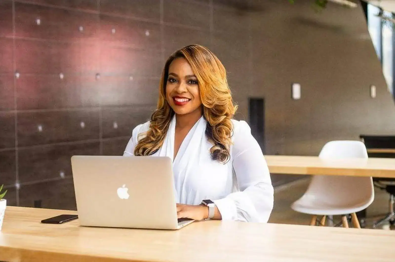 Claire B. Soares at her laptop, where her AI employee works from one instructions file