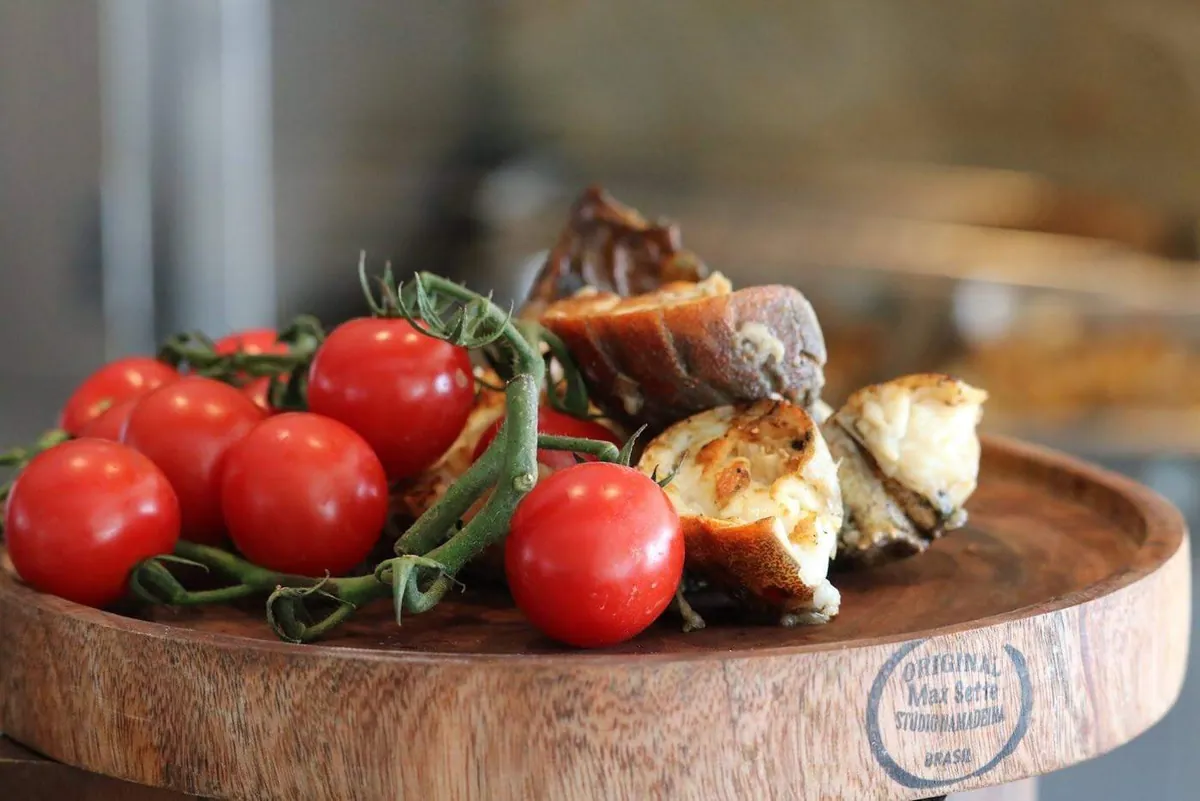 A long lunch plate of tomatoes and grilled bread