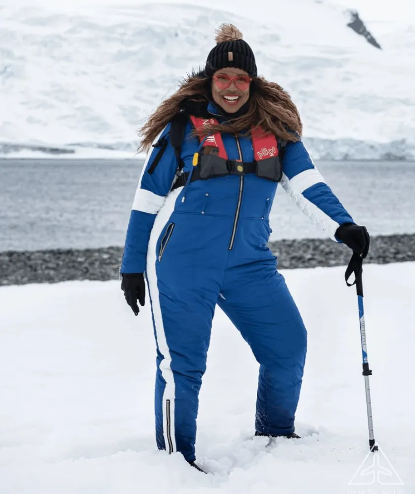 Claire in a blue snowsuit in Antarctica